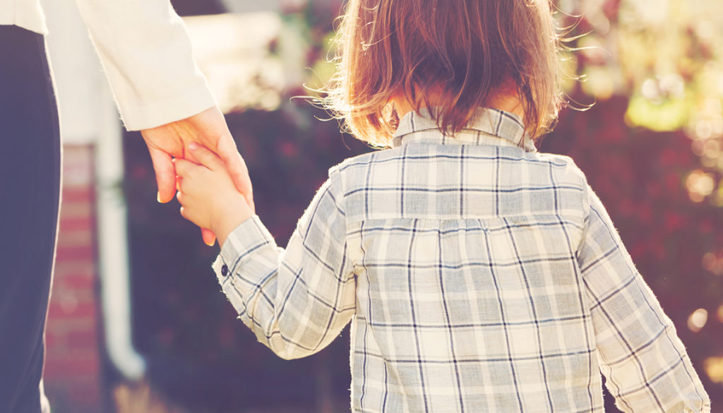 Toddler Girl Holding Hands With Her Mother