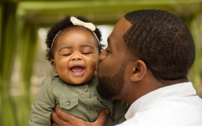 DAD KISSING BABY