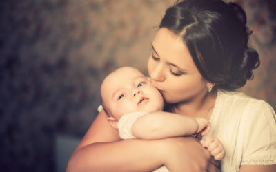 MOM KISSING BABY