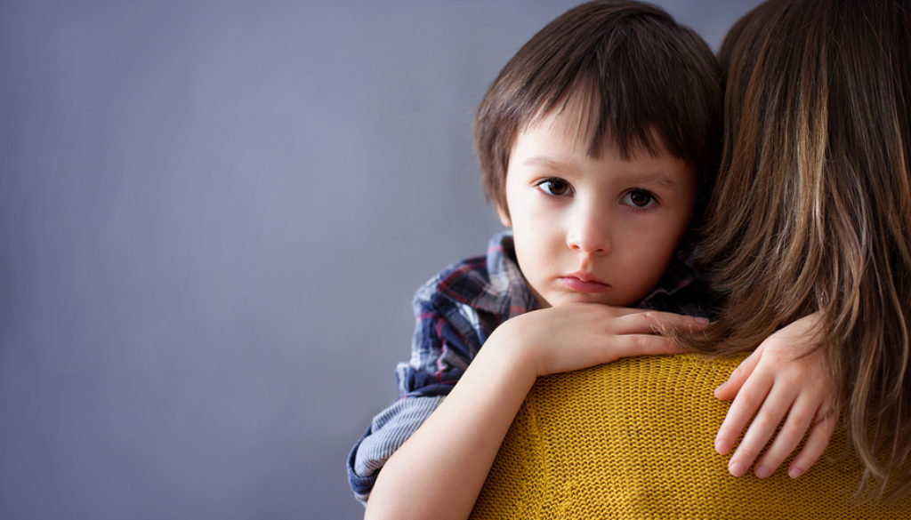 Sad Little Child, Boy, Hugging His Mother At Home